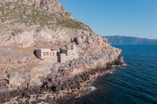 An aerial shot of houses on the hill in the old town of Monemvasia, Greece