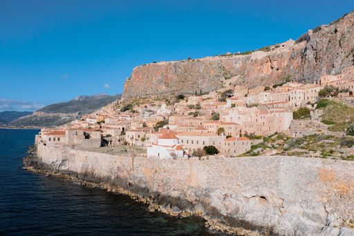 An aerial shot of houses on the hill in the old town of Monemvasia, Greece