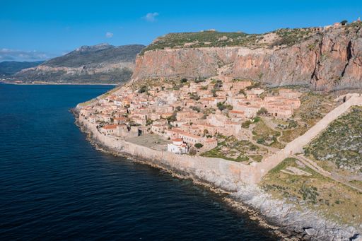 An aerial shot of houses on the hill in the old town of Monemvasia, Greece