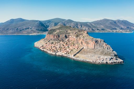 An aerial shot of houses on the hill in the old town of Monemvasia, Greece
