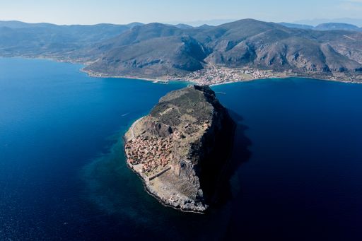 An aerial shot of houses on the hill in the old town of Monemvasia, Greece