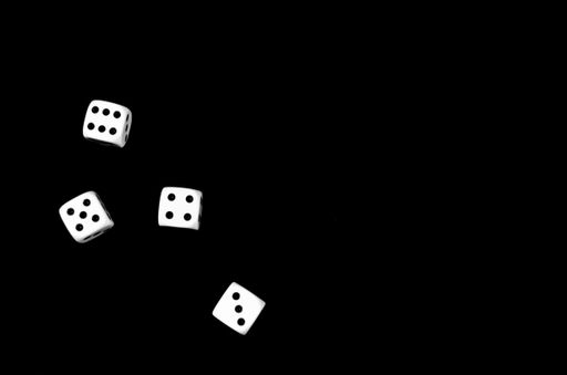 A top view of dice isolated on a black background with space for text