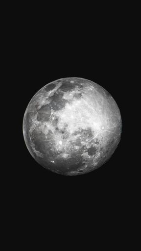 A mystic vertical close up shot of the moon on dark background