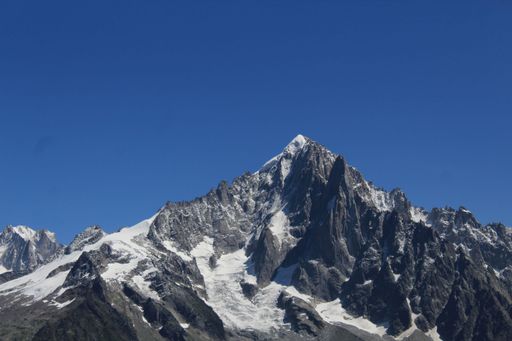 This majestic winter scene features the snow-capped peaks of Chamonix, a commune in the Haute-Savoie department of France