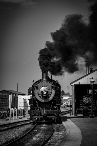 A scenic view of the Strassburg railroad with a selection of vintage trains in the foreground
