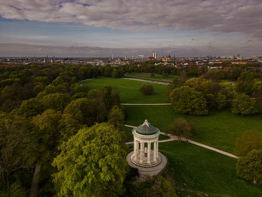 a drone shot from the famous Monopteros pavillon in Munich, English Garden Park in spring