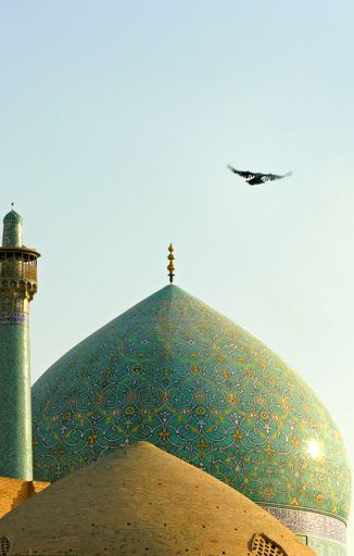 Domes on mosques in the evening sunlight, in Isfahan, Iran.