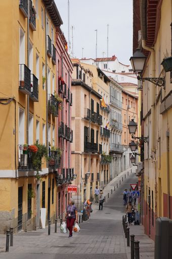 The Classic Street of a Madrid neighborhood called Lavapies with people walking around