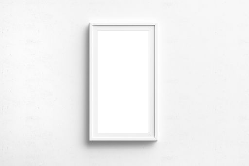 A white rectangular picture frame hanging on the wall with copyspace