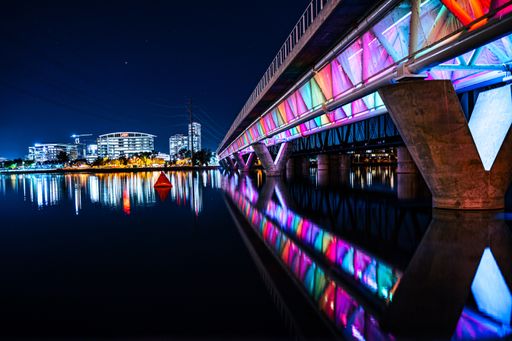 A night shot of Tempe town lake with the famous rainbow colored bridge in Papago Park Phoenix, USA