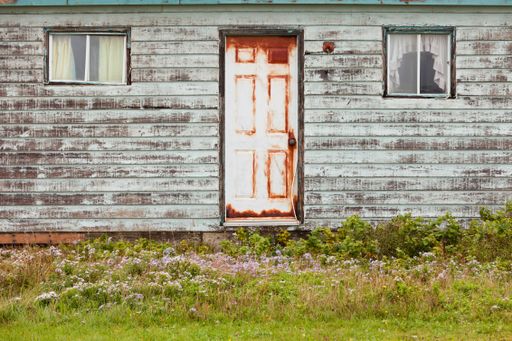 The entrance wall of an old farmhouse in the countryside