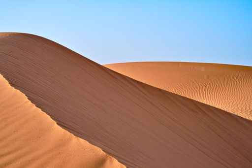 A beautiful view of the desert landscape with sand dunes in the foreground Sahara Desert, Morocco