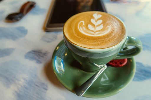 A closeup shot of beautifully made cappuccino with foam art