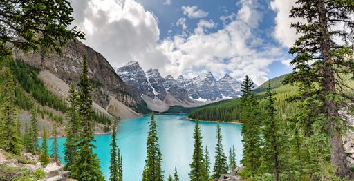 A beautiful view of the Moraine lake with snow-covered rocky mountains in Banff National Park, Canada