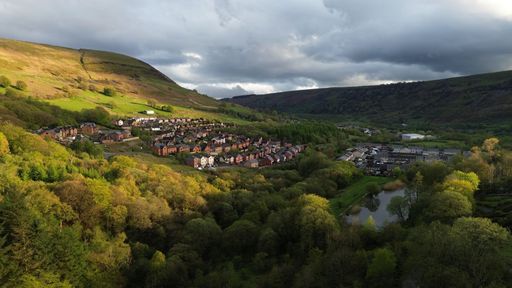 An aerial view of a lush green Welsh mining valley