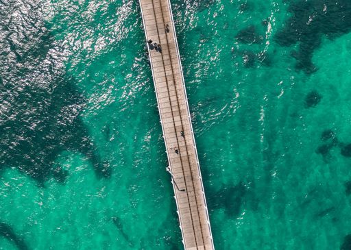 An aerial view of people walking on pier over sea, Hervey Bay QLD, Australia
