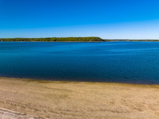 An aerial shot over West Neck Beach on Long Island in the suburb of Lloyd Harbor New York on a sunny day