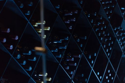 A spacious wine cellar filled with a variety of bottles of wine