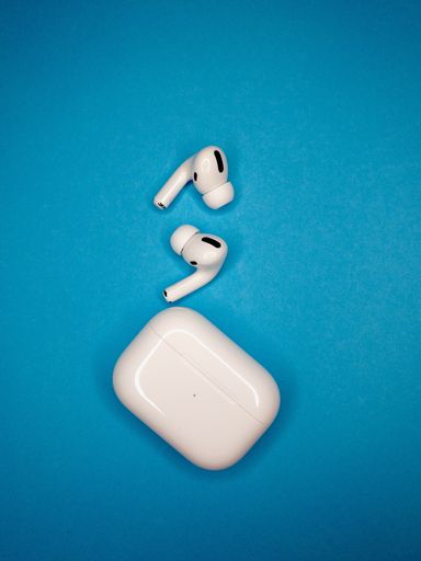 Apple AirPods Pro in Case on colorful background.