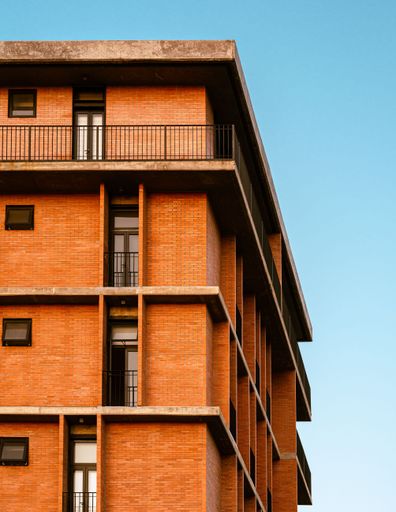 A closeup of an Old brick building under the blue sky in Mexico
