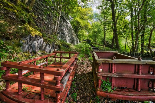The two old red trolleys of an abandoned mine in Eryri National Park. Wales, UK.