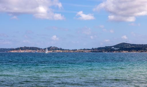 View from Port Grimaud towards Saint Tropez with the bay, the Mediterranean Sea and ships and the harbour