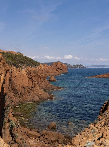 A scenic coastal shoreline featuring cliffs and a vast expanse of blue ocean. French Riviera.