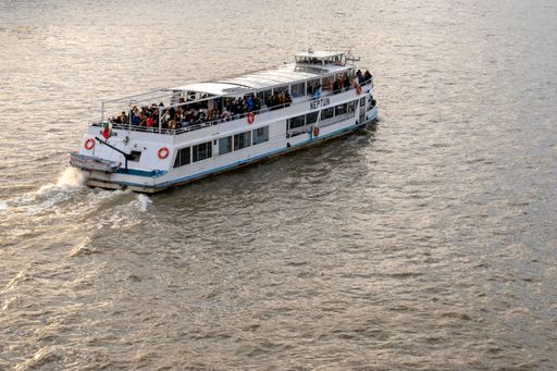 A riverboat on the water on a sunny day in Budapest, Hungary