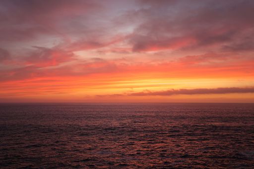 A mesmerizing view of the dusk in orange and pink colors on the Atlantic Ocean La Palma Canary Islands