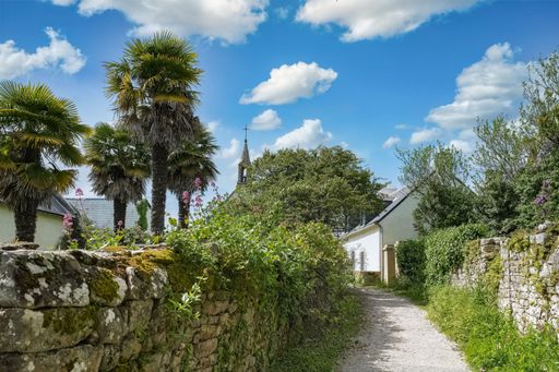 A small street and beautiful houses in the village of Brittany, Ile aux Moines island in the Morbihan Gulf.
