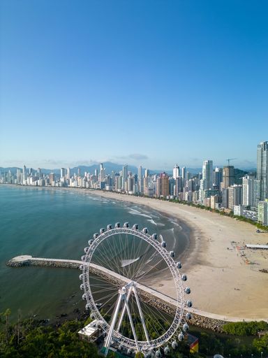 A spectacular view of a huge paddle wheel on Balneario Camboriu city beach