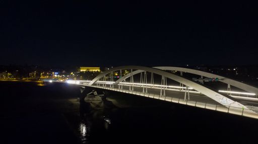 A beautiful view of a cityscape with an illuminated bridge at night in Germany