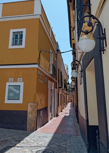 A vertical shot of the Hospital los Venerables in Seville, Spain