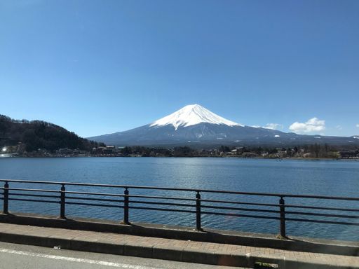 A scenic view of Mount Fuji with a tranquil body of water in the foreground. Japan.