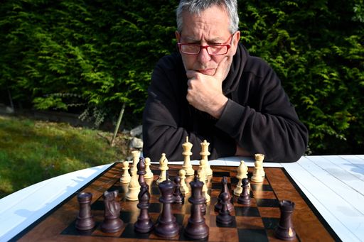 Different pieces on a wooden chess board