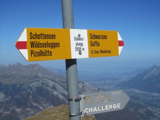 Signpost on the 5-lake hiking trail on the Pizol, St. Gallen, Switzerland. Schwarzplangg is the highest point on the trail.
