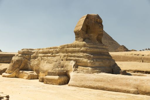 The iconic Sphinx stands guard at the Pyramids of Giza in Egypt on a sunny day