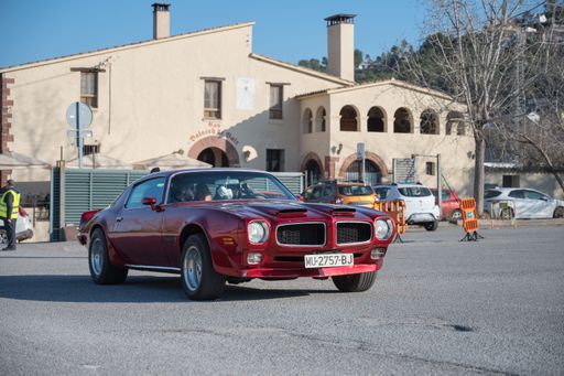 A classic American sports car of second-generation Pontiac Firebird Formula 400 on the street