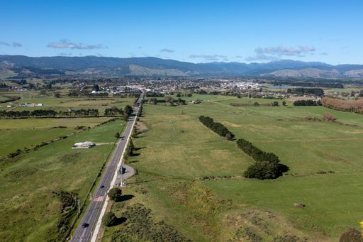 Aerial shot of Otaki Township from the beach suburb showing surrounding farmland and in the distance the Tararua Mountains