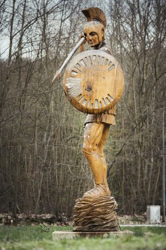 Spartan statue made of wood in front of a building at the university campus in Saarbruecken Germany