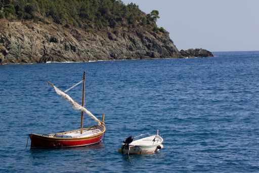 Five Lands, Italy - october 2020: sailboat sways over a crystal clear sea. Hires photo.
