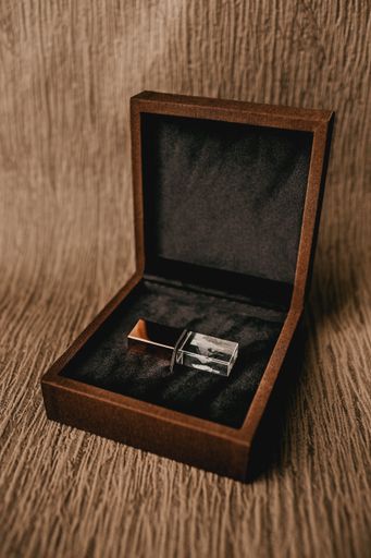 A vertical shot of a crystal USB flash drive in a box