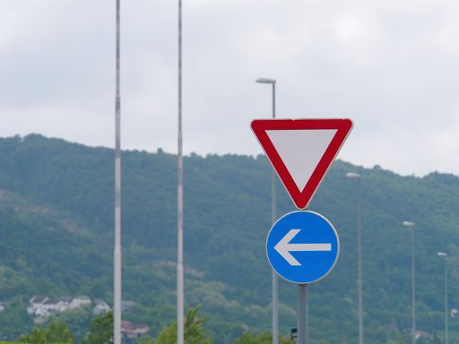 The roundabout road sign on the highway road