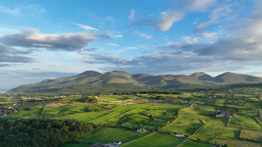An aerial view of a beautiful mountainous landscape in Ireland