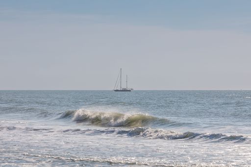 A stunning image of a small sailboat in the beautiful waters of the Gulf of Mexico in southern Florida