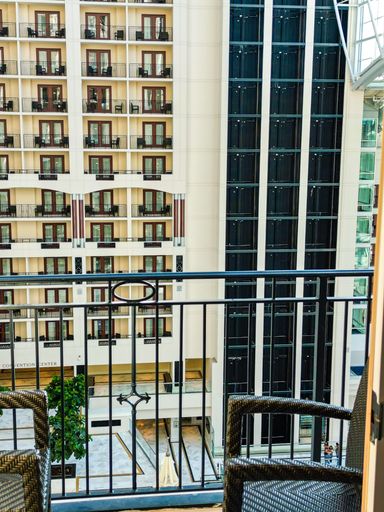 View of a tall modern building from a balcony