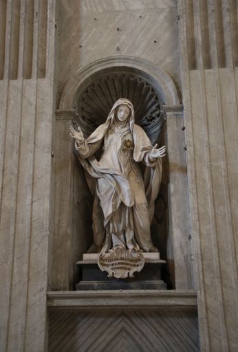 A close-up of a bronze statue of Saint Juliana Falconieri located inside the Saint Peter Basilica in the Vatican
