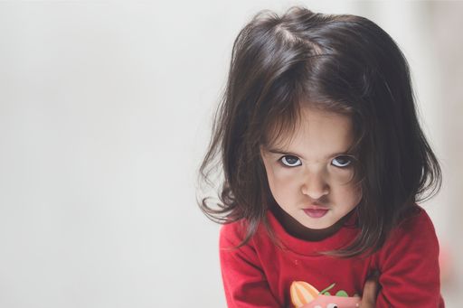 2 year 4 months cute and adorable Asian Indian baby girl looking at camera and giving cute expressions