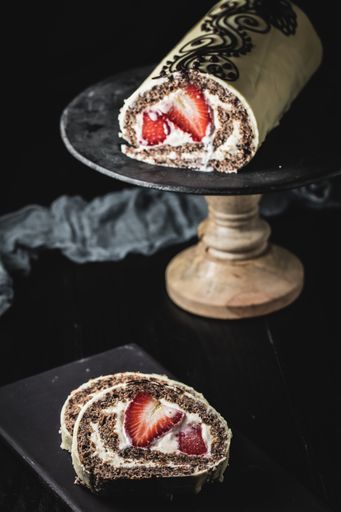 A beautiful shot of strawberry roulettes on the stand