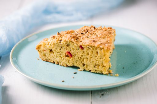 A closeup shot of a piece of cake on the blue plate